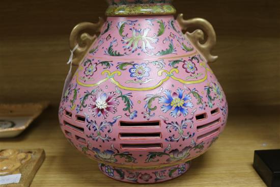 A Chinese pink sgraffito ground double walled vase